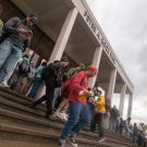 Students walking outside of rock hall