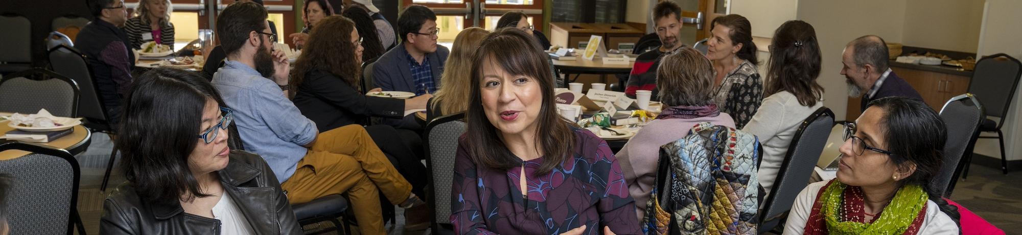 Faculty at FRIENDS event are having a lively discussion